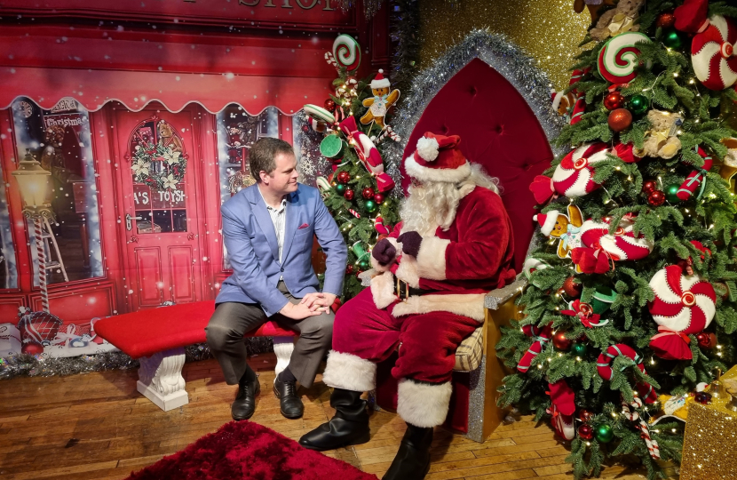 Kevin talking with "Father Christmas" at the Rotary Grotto in Fleet Walk.