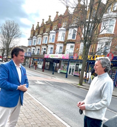 Kevin speaking to a local businessman in Paignton High Street 